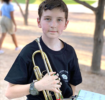 Student holding his trumpet