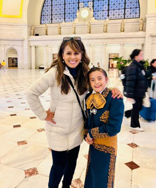 Superintendent Herrera and student posing for a picture